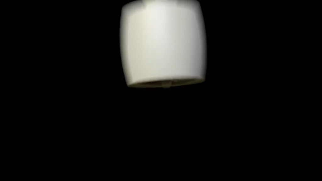 Ein schwarzes Bild, in welchem eine verschwommene Turbine zu sehen ist